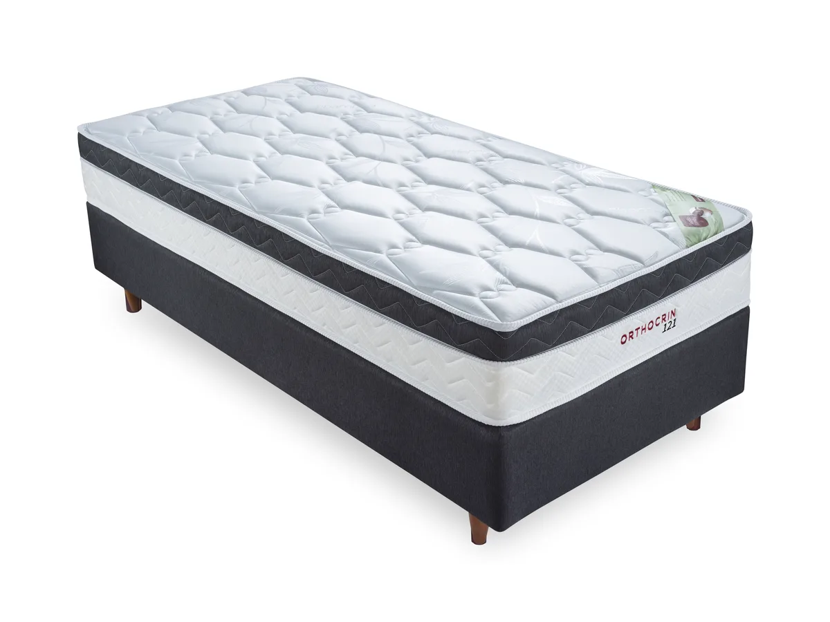 Colchão de molas ensacadas Orthocrin Série 101 sobre cama box escura